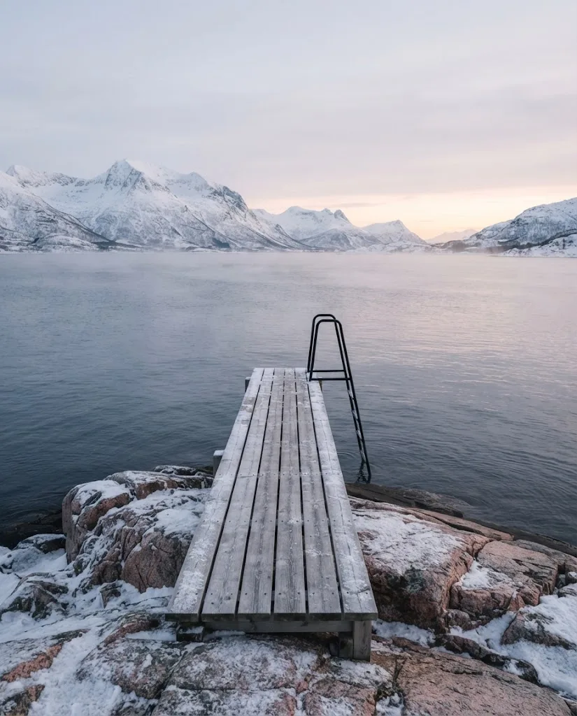 Artist's impression of a timber jetty with a ladder into the cold sea, steam rising in winter
